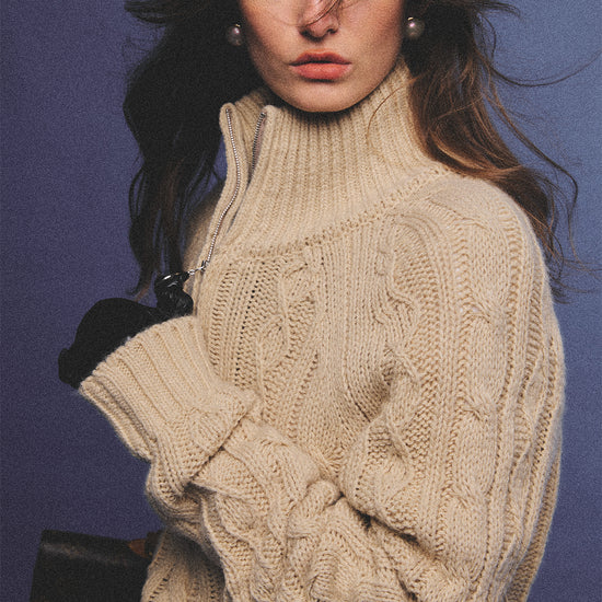Arosris oatmeal latte cable knit half-zip sweater elegantly styled on a model over a crisp white collared shirt, capturing an effortless 90s preppy and old money academia aesthetic.