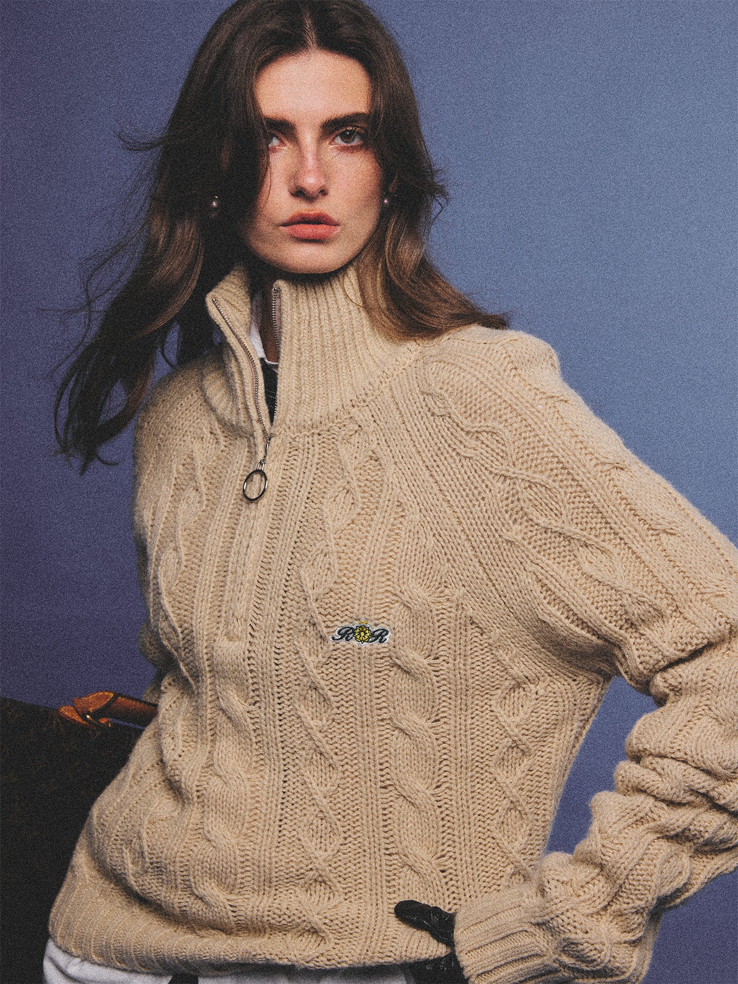 Arosris oatmeal latte cable knit half-zip sweater elegantly styled on a model over a crisp white collared shirt, capturing an effortless 90s preppy and old money academia aesthetic.
