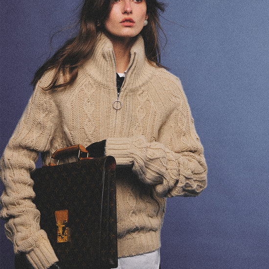 Arosris oatmeal latte cable knit half-zip sweater elegantly styled on a model over a crisp white collared shirt, capturing an effortless 90s preppy and old money academia aesthetic.