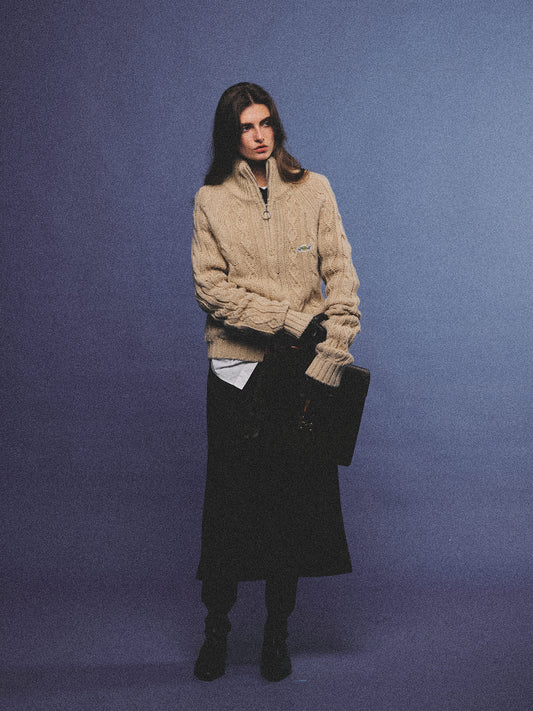Arosris oatmeal latte cable knit half-zip sweater elegantly styled on a model over a crisp white collared shirt, capturing an effortless 90s preppy and old money academia aesthetic.