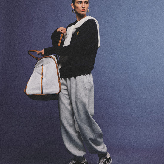 Arosris heather grey classic 100% cotton jogger sweatpants, styled with retro sneakers and layered activewear for an effortless 90s sporty-chic off-duty aesthetic.