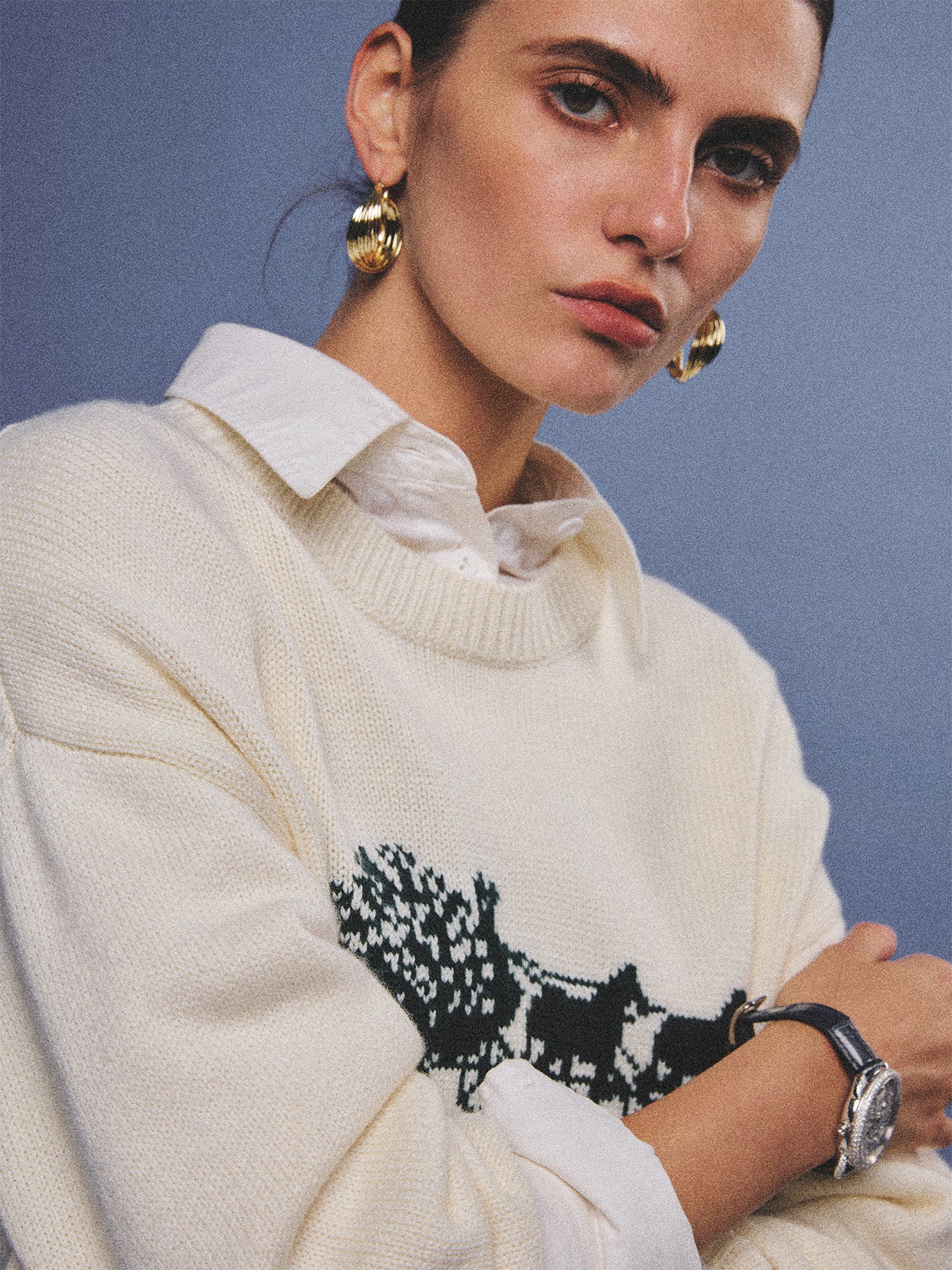 Arosris cream vintage-inspired carriage graphic wool blend sweater elegantly styled on a model with retro accessories, capturing an old money and preppy country club aesthetic.