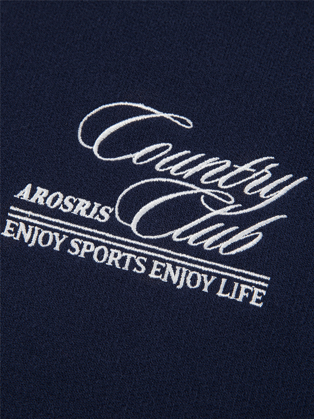 Arosris navy country club half-zip sweatshirt showcasing a structured mock neck, vintage bronze hardware, and custom script embroidery on a premium cotton blend.