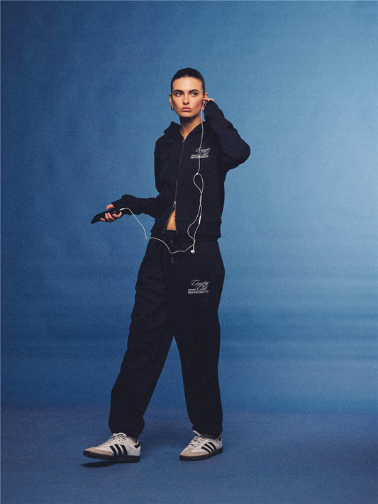 Arosris navy country club slim zip hoodie, styled with matching sweatpants and retro sneakers for an effortless 90s off-duty sporty-chic aesthetic.