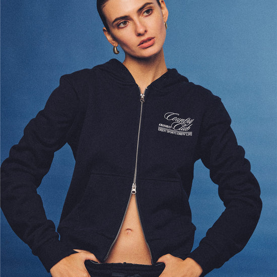 Arosris navy country club slim zip hoodie, styled with matching sweatpants and retro sneakers for an effortless 90s off-duty sporty-chic aesthetic.