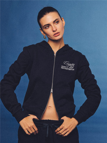 Arosris navy country club slim zip hoodie, styled with matching sweatpants and retro sneakers for an effortless 90s off-duty sporty-chic aesthetic.