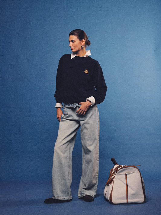 Arosris navy offshore crest crewneck sweatshirt with gold embroidery, styled with vintage accessories for an effortless 90s sporty-rich country club aesthetic.