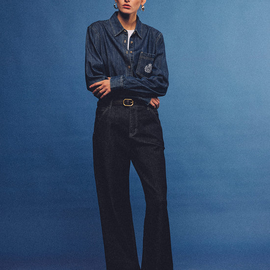 Arosris washed blue offshore crest denim shirt with nautical embroidery, styled as a cohesive 90s vintage double-denim outfit.