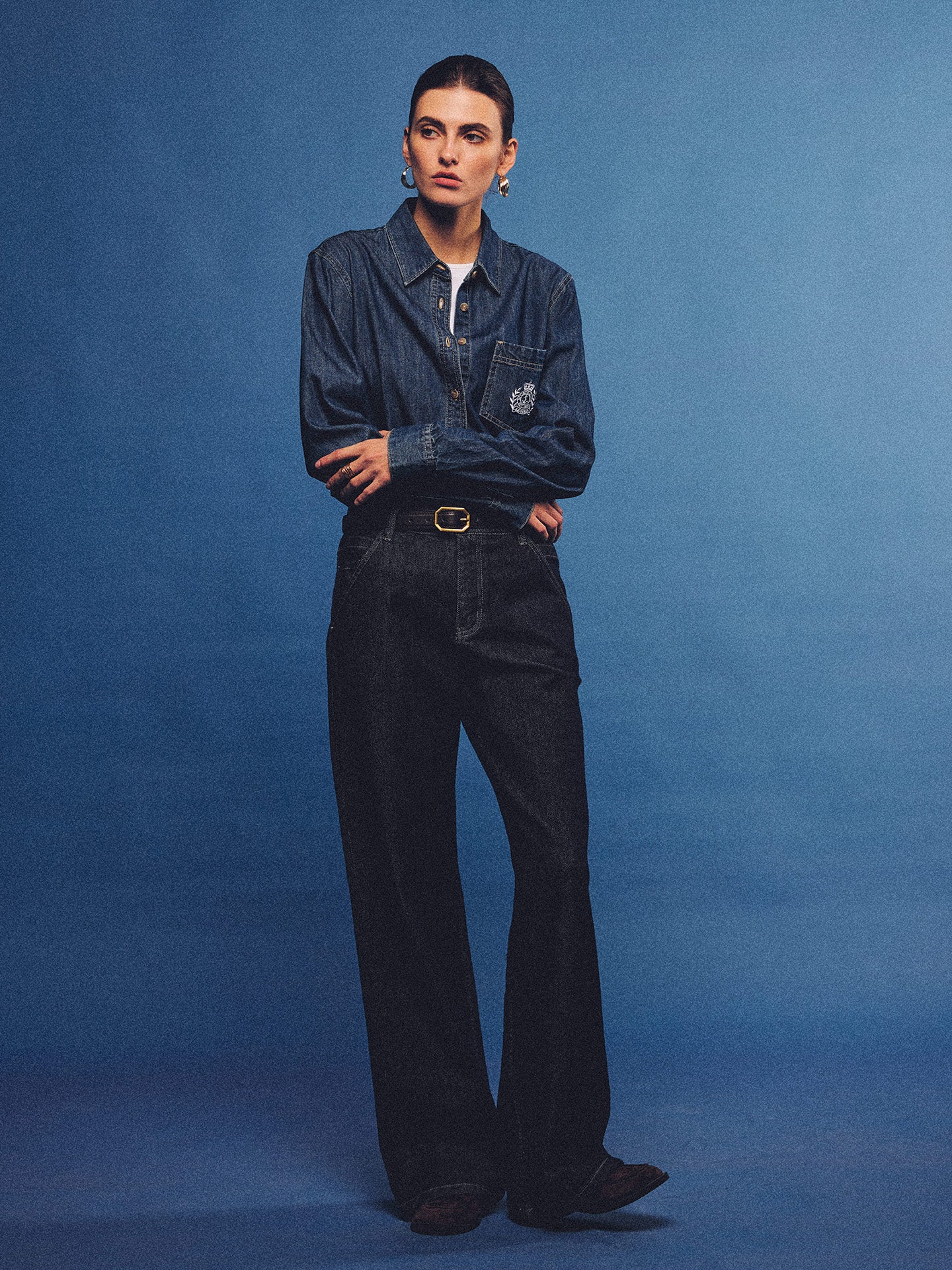 Arosris washed blue offshore crest denim shirt with nautical embroidery, styled as a cohesive 90s vintage double-denim outfit.