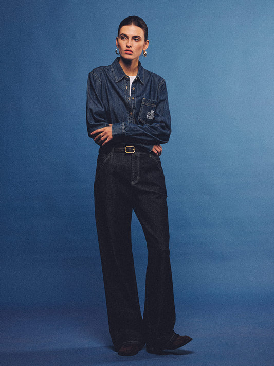 Arosris washed blue offshore crest denim shirt with nautical embroidery, styled as a cohesive 90s vintage double-denim outfit.