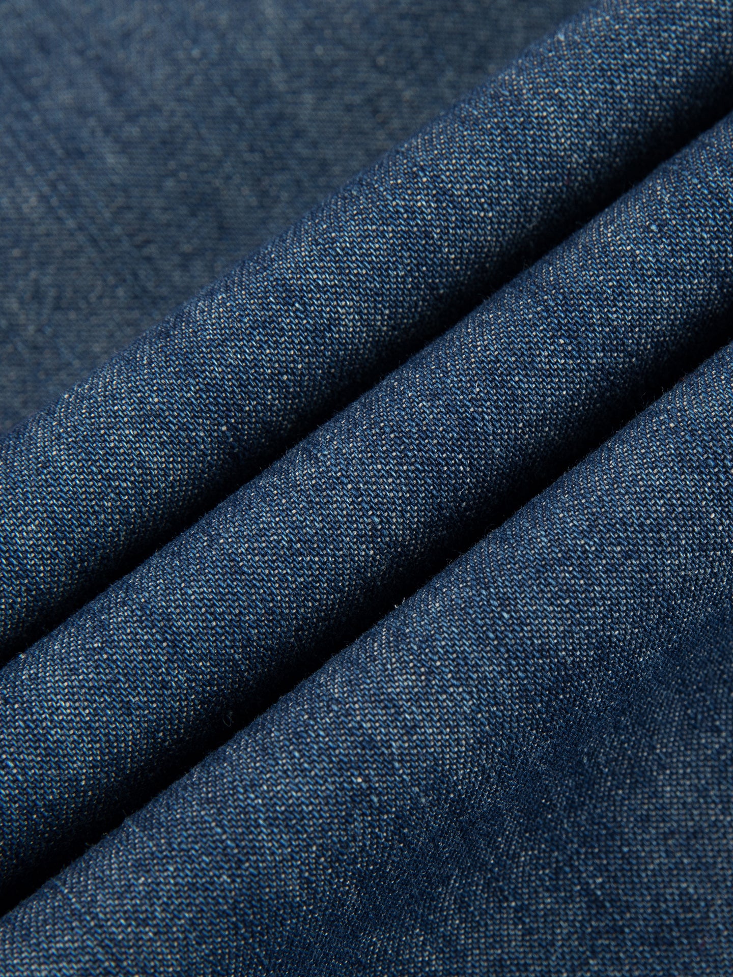 Arosris washed blue offshore crest denim shirt showcasing a classic fit, premium vintage wash, and signature nautical anchor chest pocket embroidery.