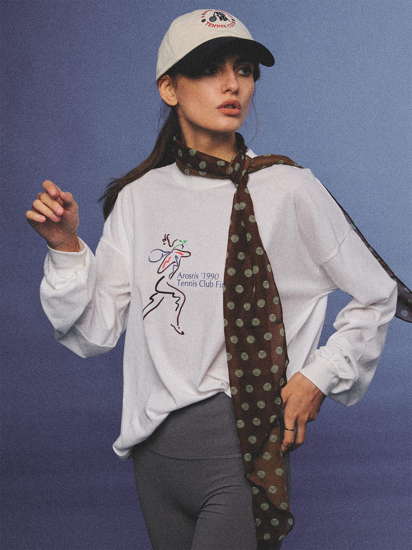 Arosris charcoal grey relaxed fit cotton t-shirt featuring a vintage 'ARR RIDING' equestrian horse graphic, styled on a model with wide-leg denim and a suede tote bag for an effortless 90s country club off-duty aesthetic.