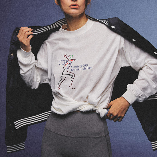 Arosris charcoal grey relaxed fit cotton t-shirt featuring a vintage 'ARR RIDING' equestrian horse graphic, styled on a model with wide-leg denim and a suede tote bag for an effortless 90s country club off-duty aesthetic.