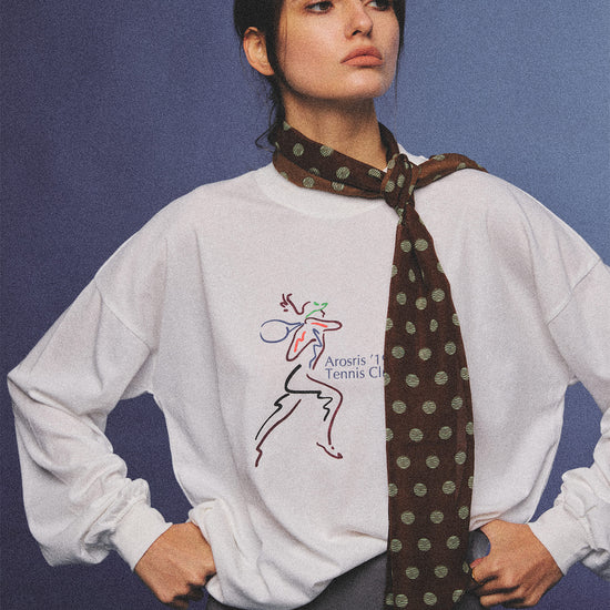 Arosris charcoal grey relaxed fit cotton t-shirt featuring a vintage 'ARR RIDING' equestrian horse graphic, styled on a model with wide-leg denim and a suede tote bag for an effortless 90s country club off-duty aesthetic.