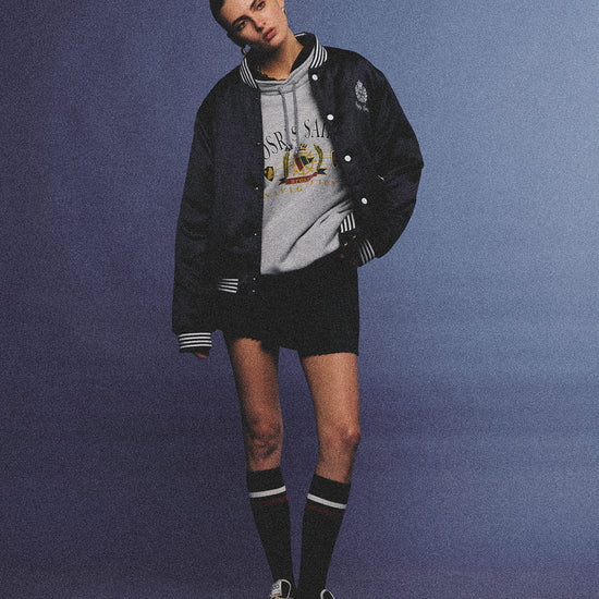 Arosris midnight navy high-gloss satin padded bomber jacket featuring a bold vintage club back embroidery, styled for an effortless 90s sporty-chic varsity aesthetic.