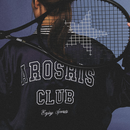 Arosris midnight navy high-gloss satin padded bomber jacket featuring a bold vintage club back embroidery, styled for an effortless 90s sporty-chic varsity aesthetic.