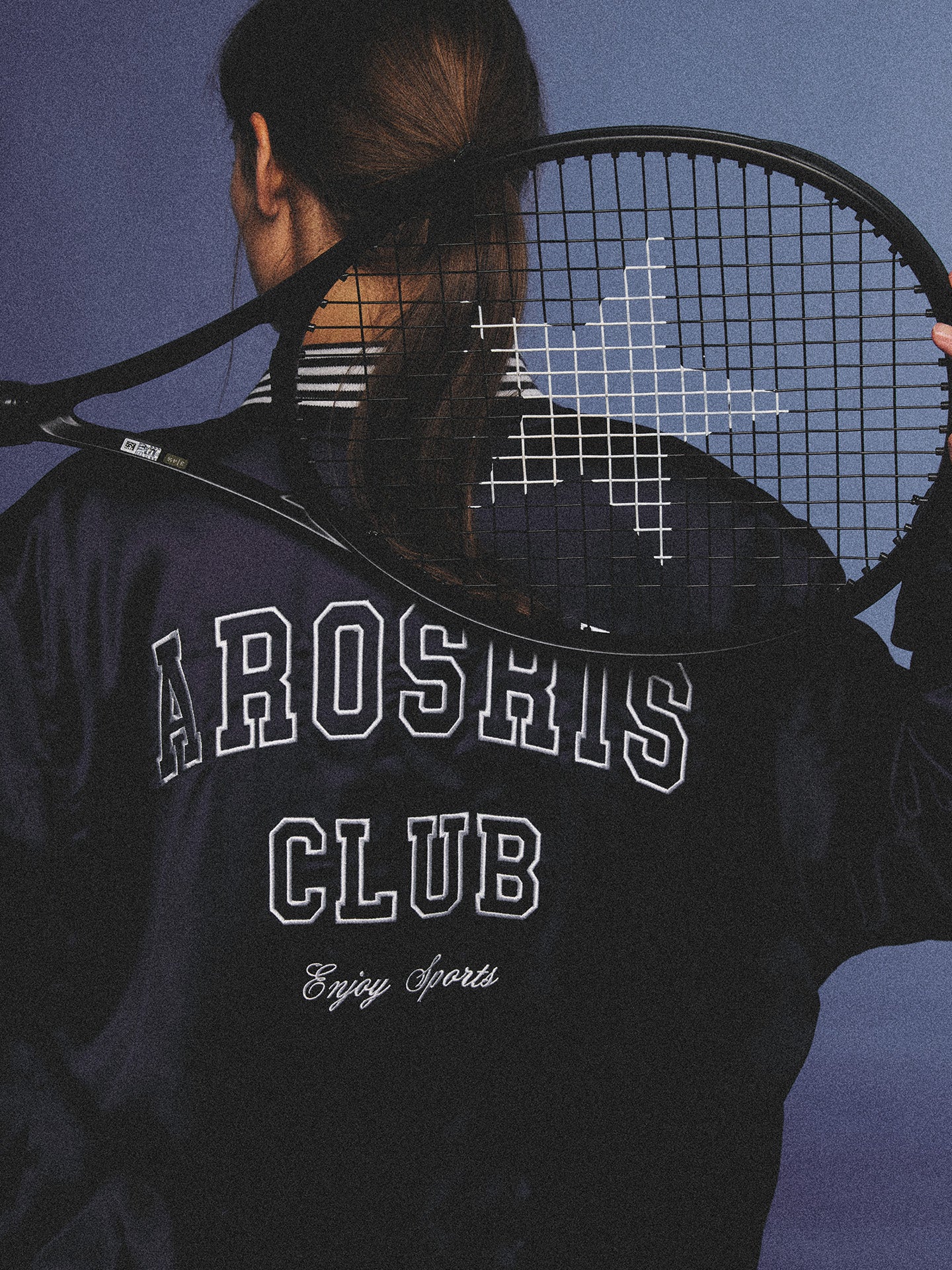 Arosris midnight navy high-gloss satin padded bomber jacket featuring a bold vintage club back embroidery, styled for an effortless 90s sporty-chic varsity aesthetic.