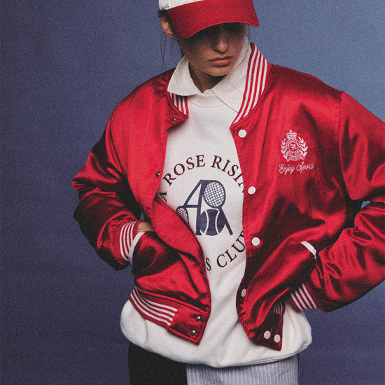 Arosris red and white vintage-inspired lustrous satin color-block cap, styled with a matching varsity jacket for an effortless 90s sporty-chic aesthetic.