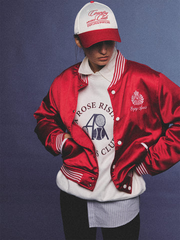 Arosris red and white vintage-inspired lustrous satin color-block cap, styled with a matching varsity jacket for an effortless 90s sporty-chic aesthetic.