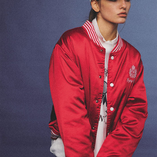 Arosris red and white vintage-inspired lustrous satin color-block cap, styled with a matching varsity jacket for an effortless 90s sporty-chic aesthetic.