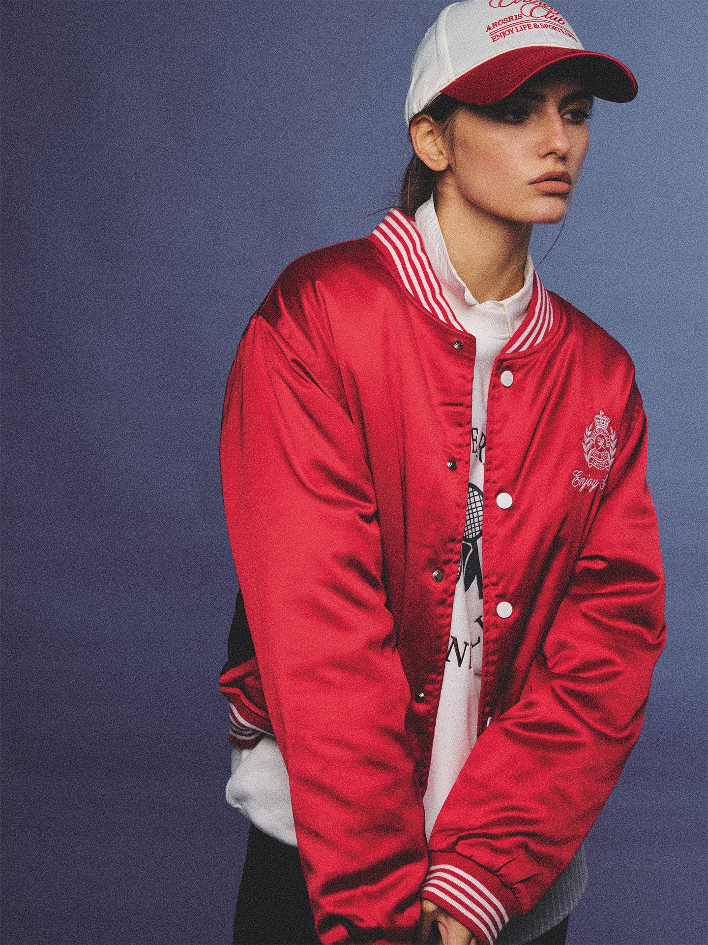 Arosris red and white vintage-inspired lustrous satin color-block cap, styled with a matching varsity jacket for an effortless 90s sporty-chic aesthetic.