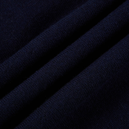 Part of The Ivy Archive. Master the 90s preppy aesthetic with our 100% sheep wool argyle polo sweater, featuring a classic collegiate pattern and crest embroidery.