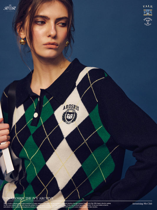 Part of The Ivy Archive. Master the 90s preppy aesthetic with our 100% sheep wool argyle polo sweater, featuring a classic collegiate pattern and crest embroidery.