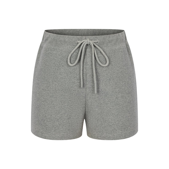 Master the retro 90s athletic aesthetic with the Ivy Archive Mid-Thigh Track Shorts. Featuring a flattering high-rise waist, modest mid-thigh coverage, and premium stretch cotton.