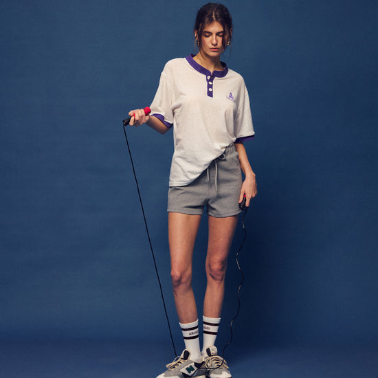 Master the retro 90s athletic aesthetic with the Ivy Archive Mid-Thigh Track Shorts. Featuring a flattering high-rise waist, modest mid-thigh coverage, and premium stretch cotton.