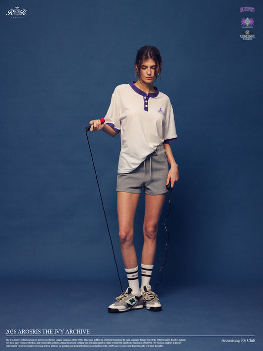 Master the retro 90s athletic aesthetic with the Ivy Archive Mid-Thigh Track Shorts. Featuring a flattering high-rise waist, modest mid-thigh coverage, and premium stretch cotton.