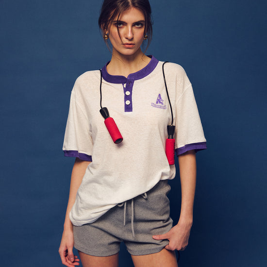 Master the retro 90s athletic aesthetic with the Ivy Archive Mid-Thigh Track Shorts. Featuring a flattering high-rise waist, modest mid-thigh coverage, and premium stretch cotton.