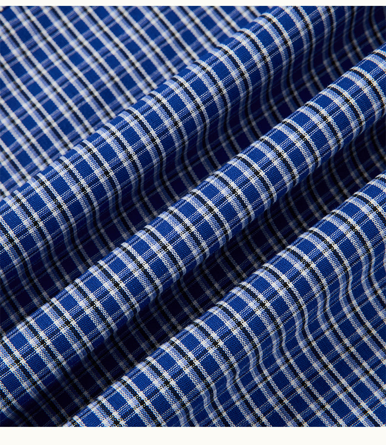 Arosris Ivy Archive oversized plaid shirt in blue, showing the collar design, button details, and 100% cotton fabric texture.