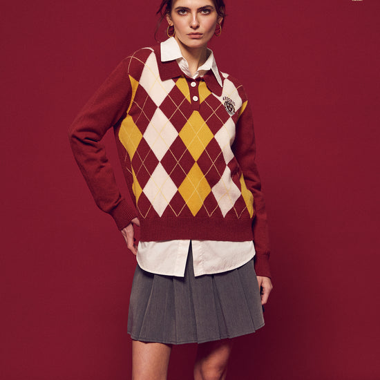 Arosris Ivy Archive pleated mini skirt in grey, styled with classic collegiate knitwear and shirting for an effortless 90s preppy look.