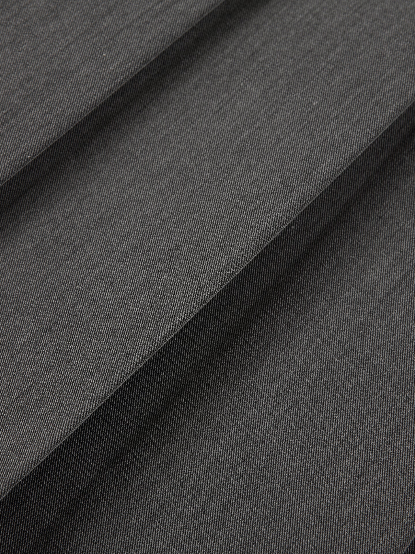 Arosris Ivy Archive pleated mini skirt in grey, showing the crisp knife-pleats, concealed side zipper, and structured fabric texture.