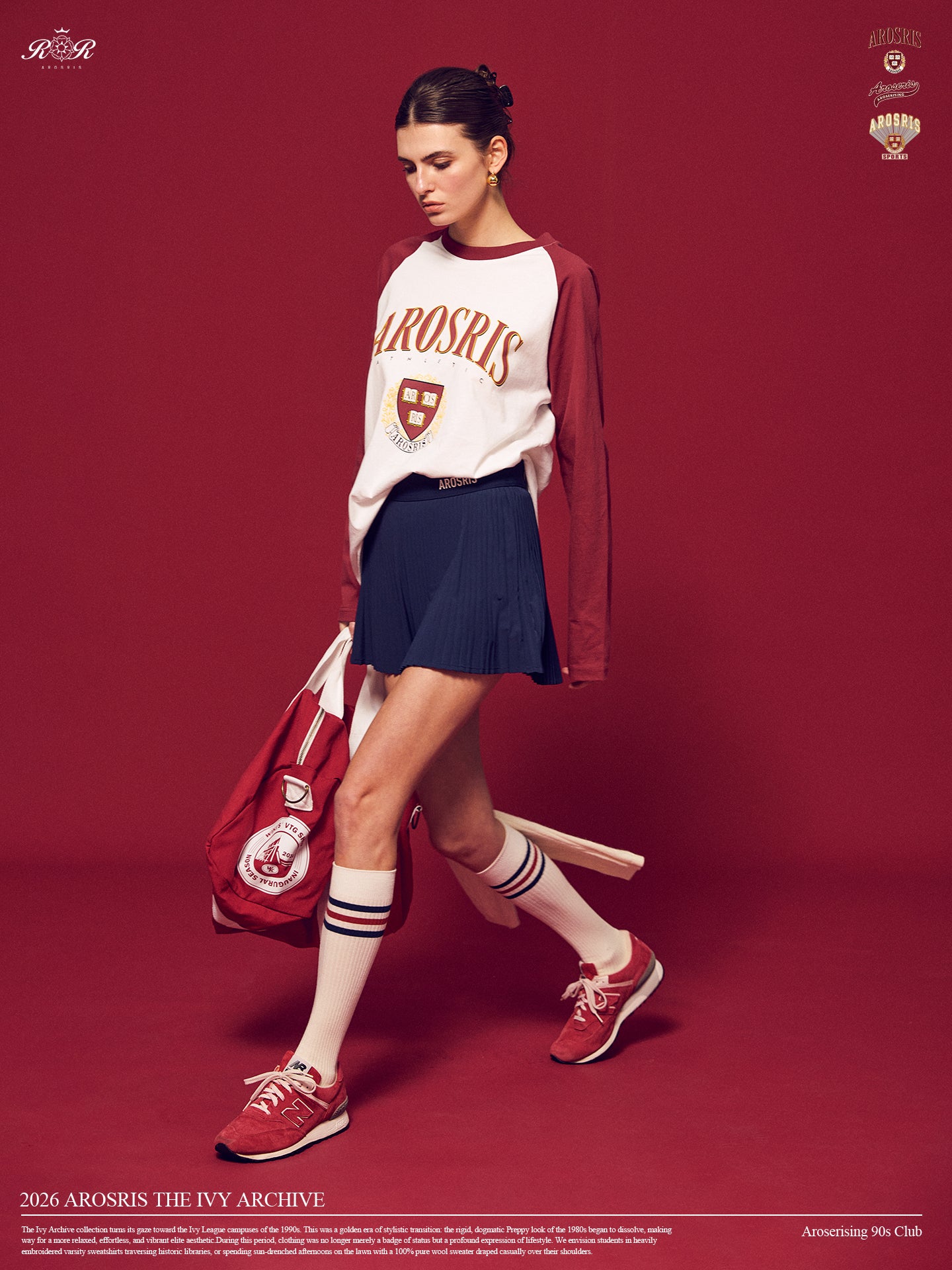 Arosris Ivy Archive collegiate raglan long sleeve in red, styled with a pleated skirt and a vintage tennis racket for an effortless 90s vintage varsity look.