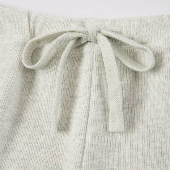 Arosris Ivy Archive high-rise varsity shorts featuring a 3-inch inseam and thick drawstring, elegantly styled on a model for an effortless 90s collegiate and sporty rich aesthetic.