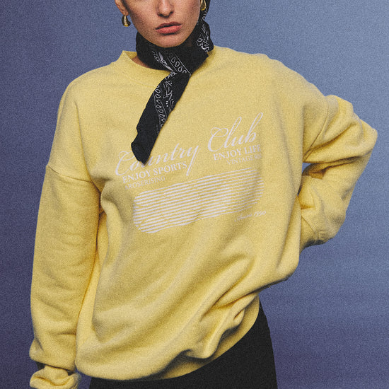 Arosris vintage white lightweight graphic training top crafted from breathable semi-sheer fabric, featuring a retro tennis sport graphic, elegantly styled for an effortless 90s sporty rich and off-duty athletic aesthetic.