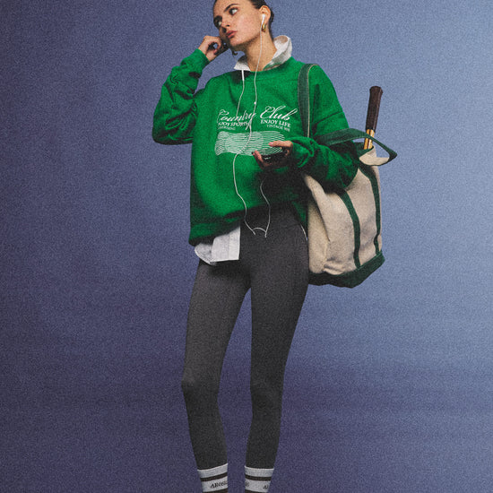Arosris vintage white lightweight graphic training top crafted from breathable semi-sheer fabric, featuring a retro tennis sport graphic, elegantly styled for an effortless 90s sporty rich and off-duty athletic aesthetic.
