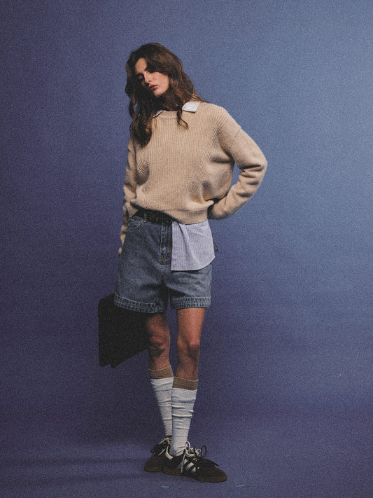 Arosris greige modern chic cashmere chunky knit sweater elegantly styled on a model over a crisp collared shirt, channeling an old money and quiet luxury aesthetic.