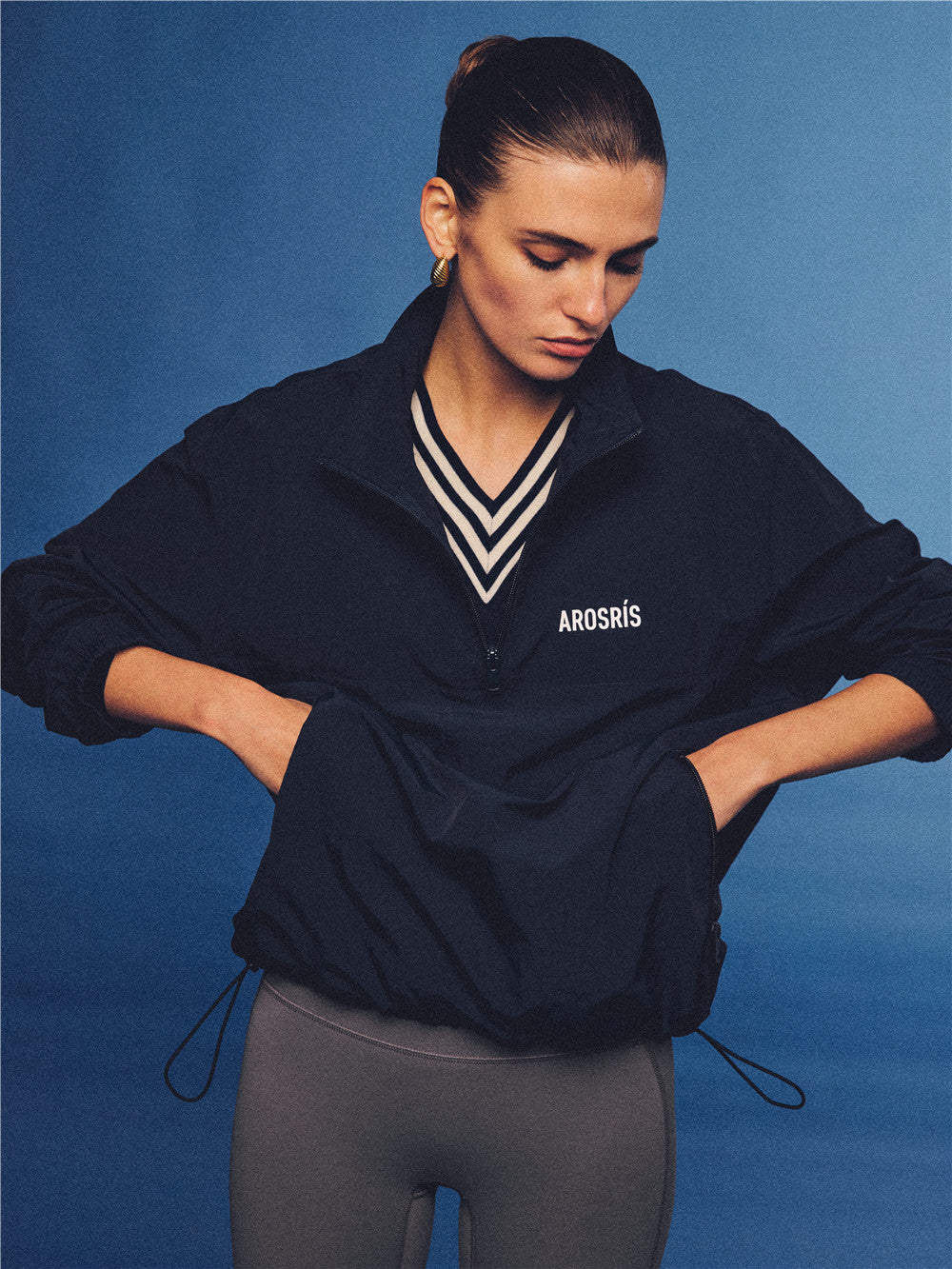 Arosris navy retro sport half-zip windproof jacket, styled with athletic leggings and layered accessories for an effortless 90s sporty-chic country club aesthetic.