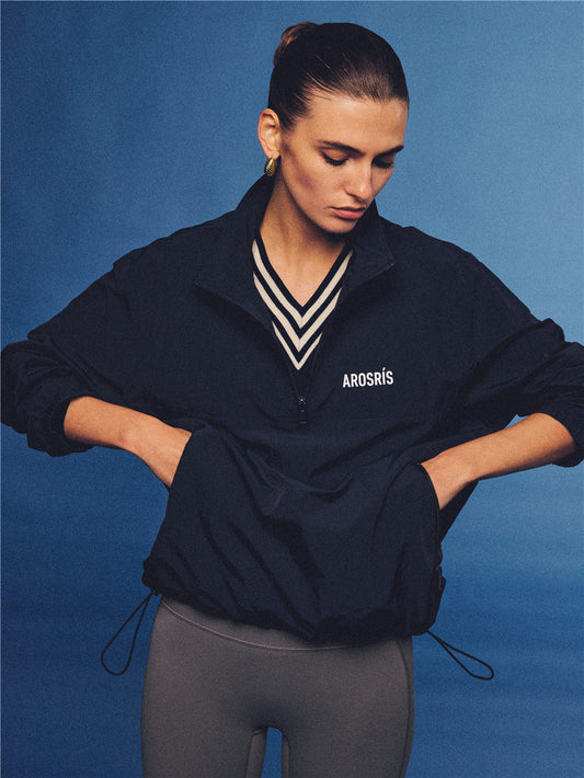 Arosris navy retro sport half-zip windproof jacket, styled with athletic leggings and layered accessories for an effortless 90s sporty-chic country club aesthetic.