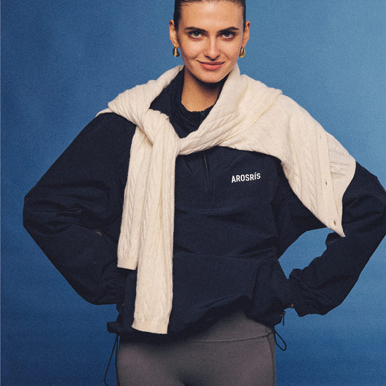 Arosris navy retro sport half-zip windproof jacket, styled with athletic leggings and layered accessories for an effortless 90s sporty-chic country club aesthetic.