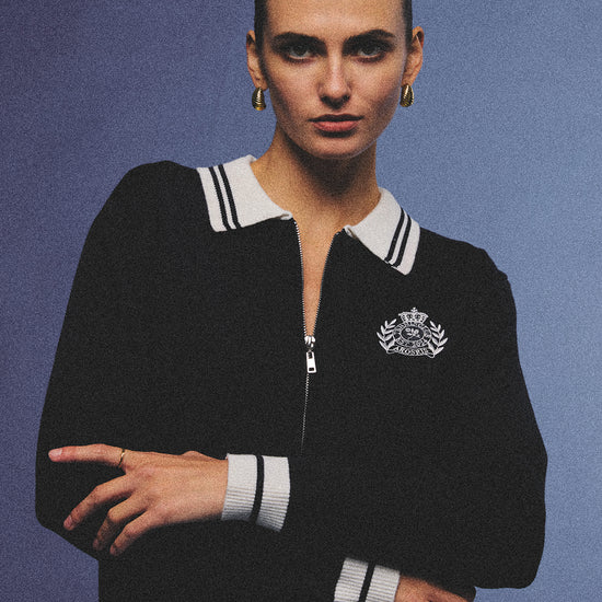 Arosris royal sapphire blue retro zip-up polo knit featuring a contrast tipped collar and vintage tennis club crest, elegantly styled for an effortless 90s old money tenniscore aesthetic.