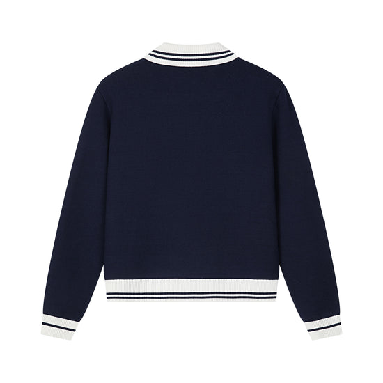 Arosris royal sapphire blue retro zip-up polo knit displayed in flat lay views, highlighting the contrast tipped collar, retro ring-pull half-zip, vintage crest embroidery, and flattering cropped silhouette.