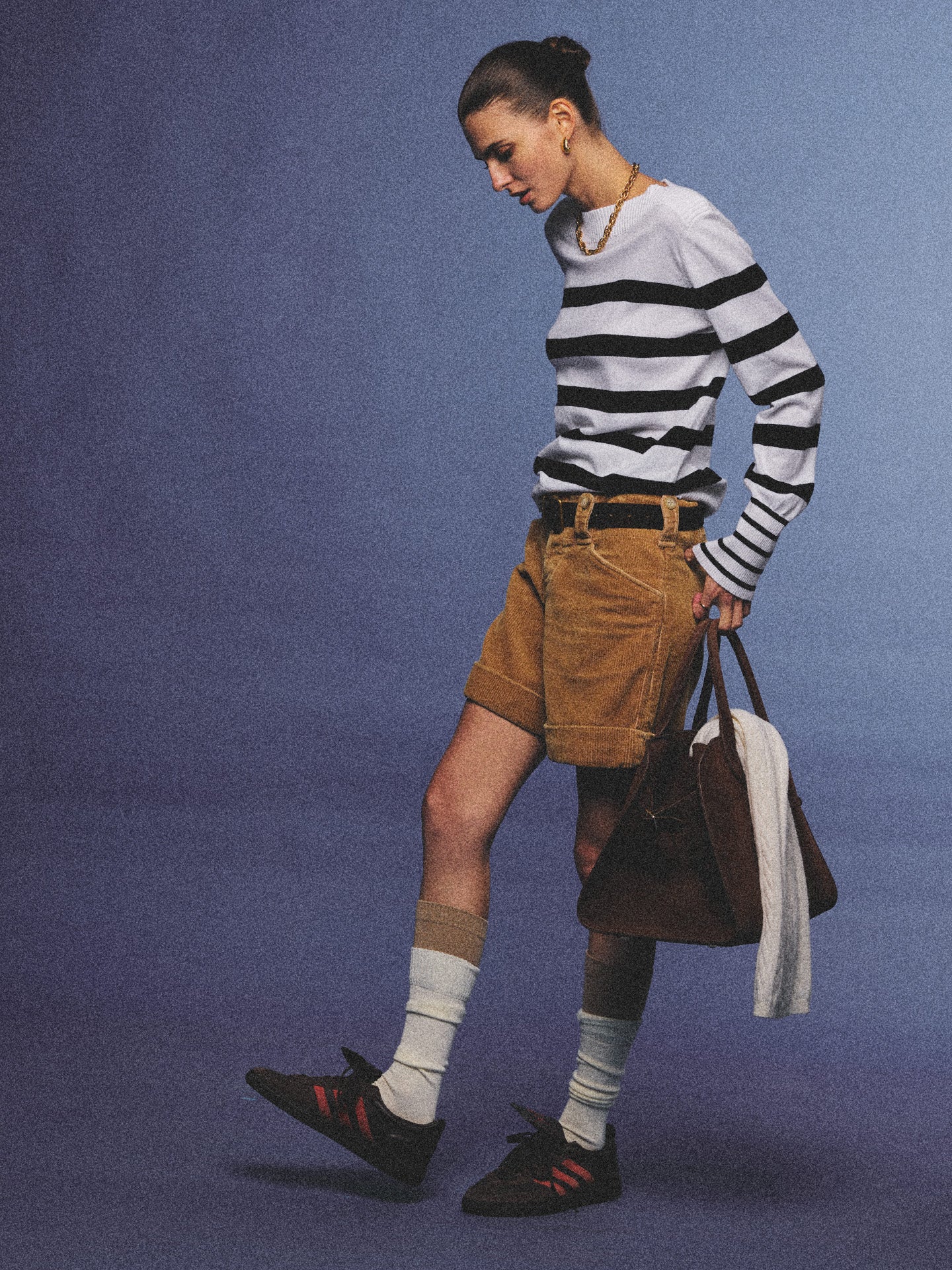 Arosris Riviera navy striped boat neck sweater elegantly styled on a model with corduroy shorts and vintage accessories, capturing an effortless 90s old money coastal resort aesthetic.