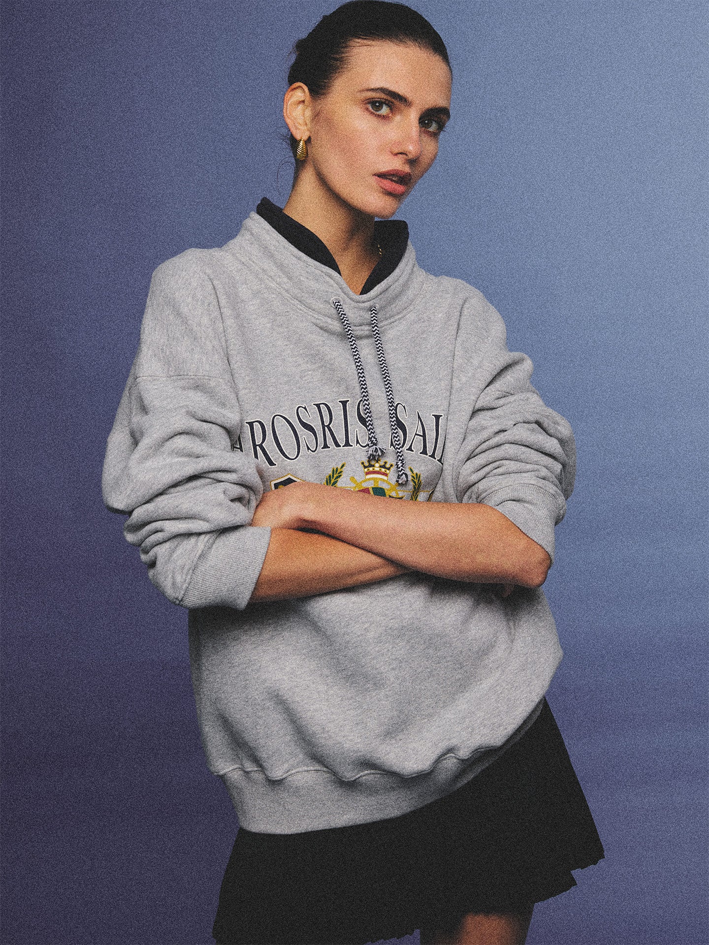 Arosris ash grey sailing navigation mock neck sweatshirt elegantly styled on a model, capturing an effortless 90s sporty-chic coastal yacht club aesthetic.