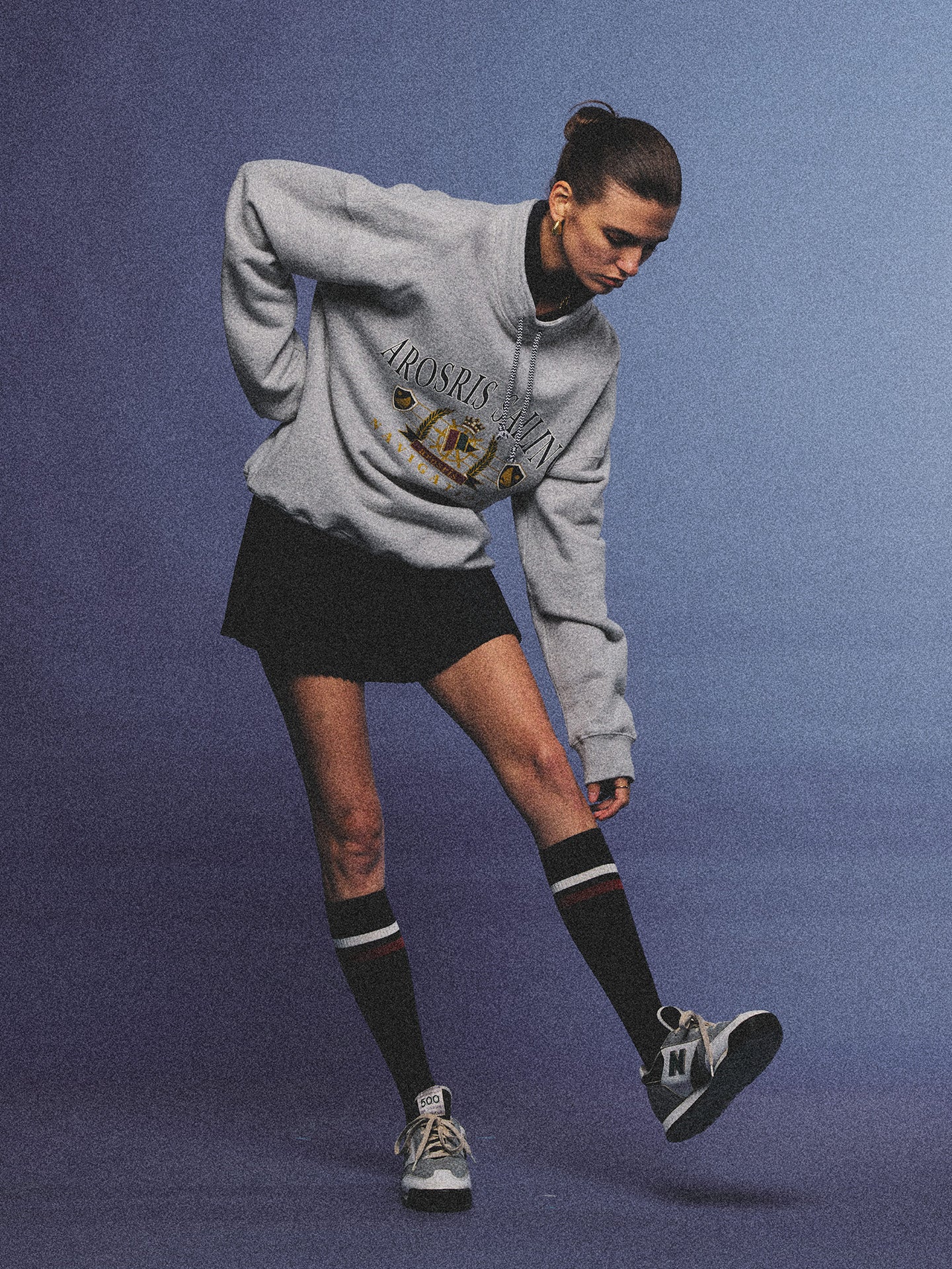 Arosris ash grey sailing navigation mock neck sweatshirt elegantly styled on a model, capturing an effortless 90s sporty-chic coastal yacht club aesthetic.