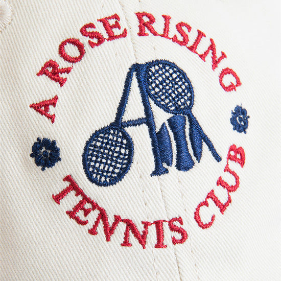 Arosris two-tone cream and navy tennis club dad hat showcasing a classic 6-panel fit, curved brim, and signature vintage crest embroidery.