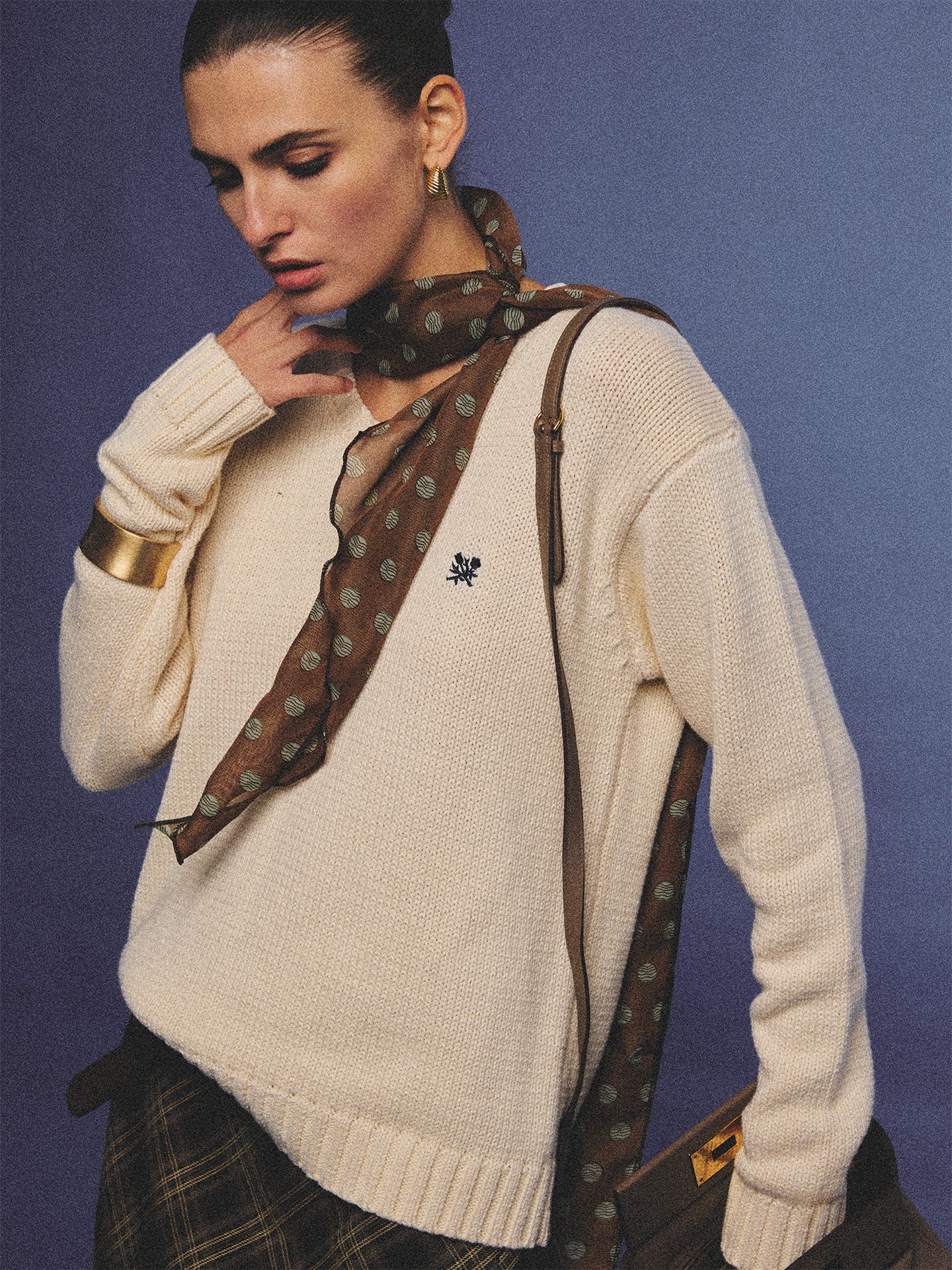 Arosris creamy khaki v-neck embroidered sweater, elegantly styled with a vintage silk scarf and plaid skirt for an effortless 90s old money aesthetic.