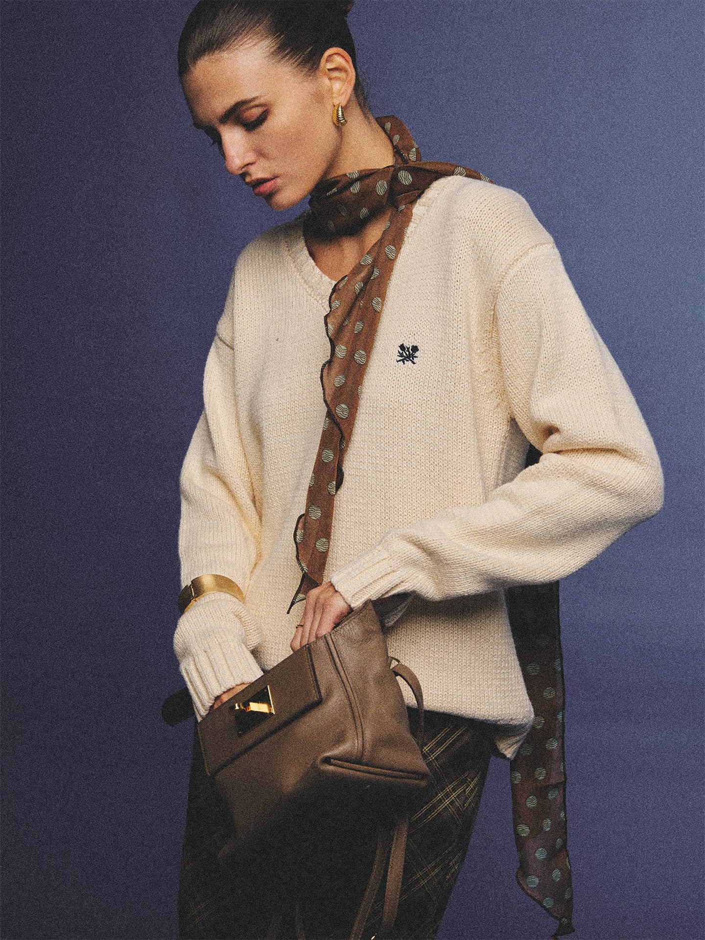 Arosris creamy khaki v-neck embroidered sweater, elegantly styled with a vintage silk scarf and plaid skirt for an effortless 90s old money aesthetic.